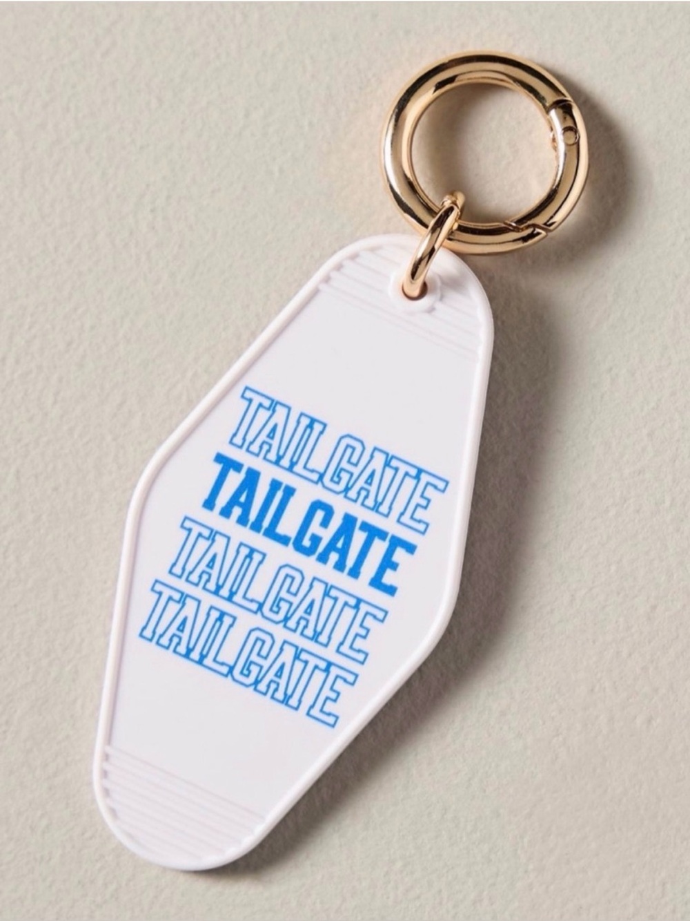 Anthropologie Tailgate Motel Keychain - Bag Charm White with Blue Text